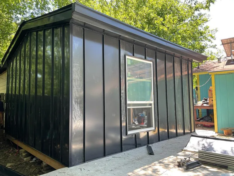 Black standing seam metal wall panels for Metal Roof Installation in Brewster